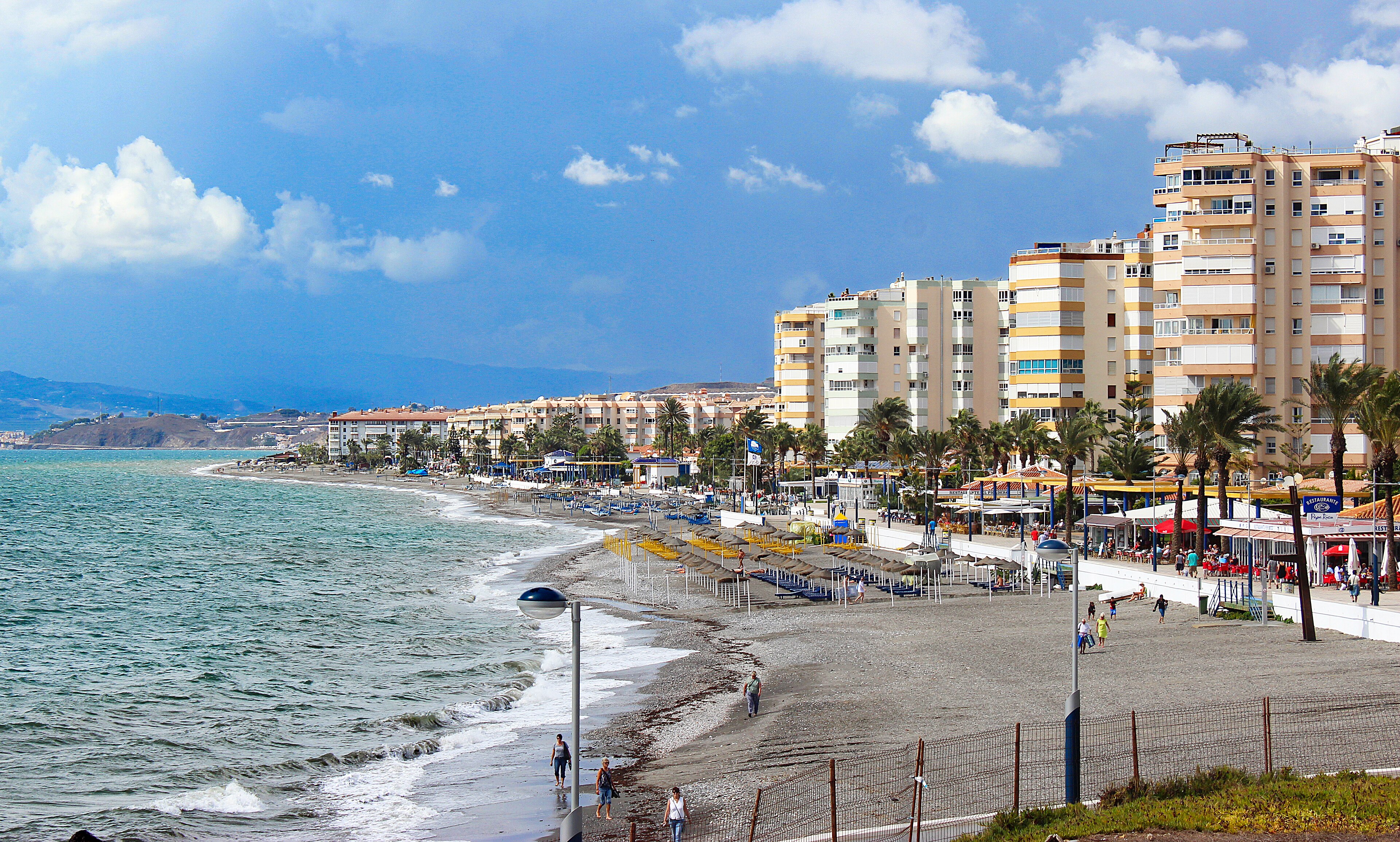 Beach promenade with palms in Torrox Costa